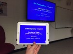 A close up of an iPad showing a PowerPoint presentation.